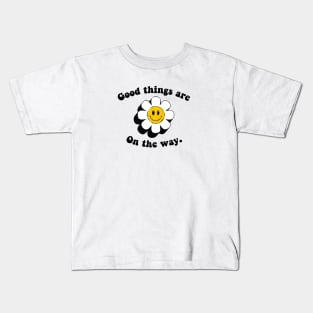 good things are on the way quote  with smiley sunflower face Kids T-Shirt